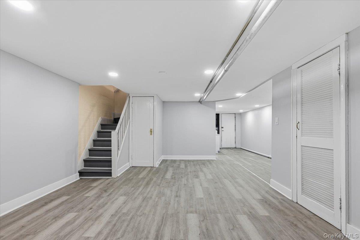 179-67 Selover Road Queens, NY 11434 - Photo 40 of 49 an empty room with wooden floor and entryway