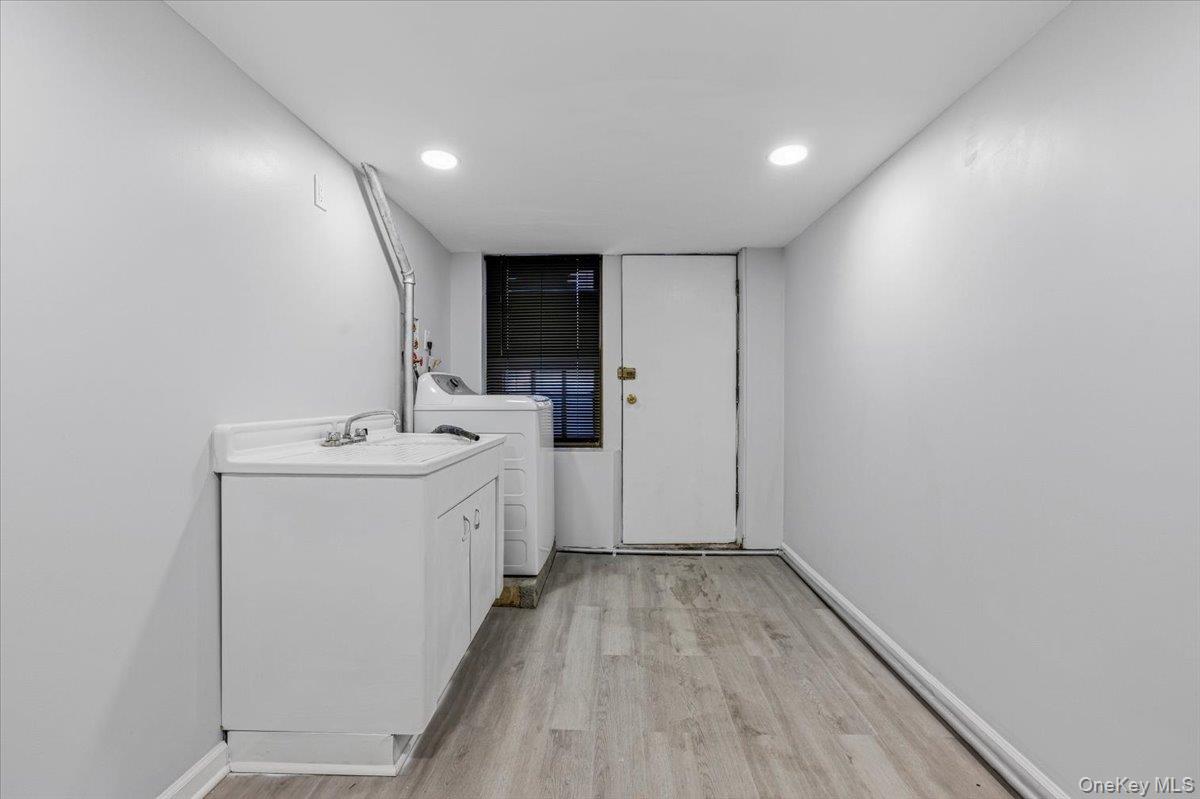 179-67 Selover Road Queens, NY 11434 - Photo 41 of 49 a bathroom with a sink and a mirror