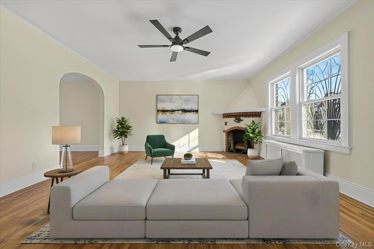 179-67 Selover Road Queens, NY 11434 - Photo 5 of 49 a living room with furniture a fireplace and a large window