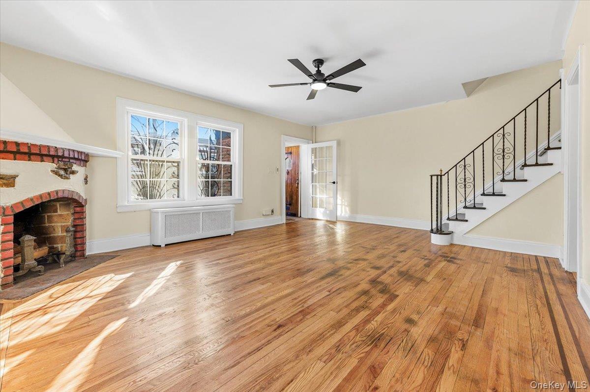 179-67 Selover Road Queens, NY 11434 - Photo 9 of 49 a view of an empty room with wooden floor and a window