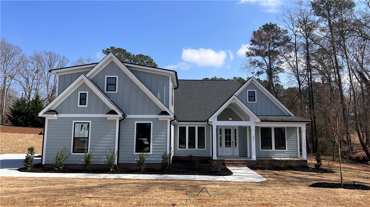This newly constructed home boasts charming architectural details and a welcoming entrance.