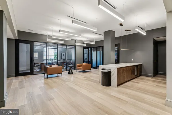 a view of a patio with couple of chairs and a fountain