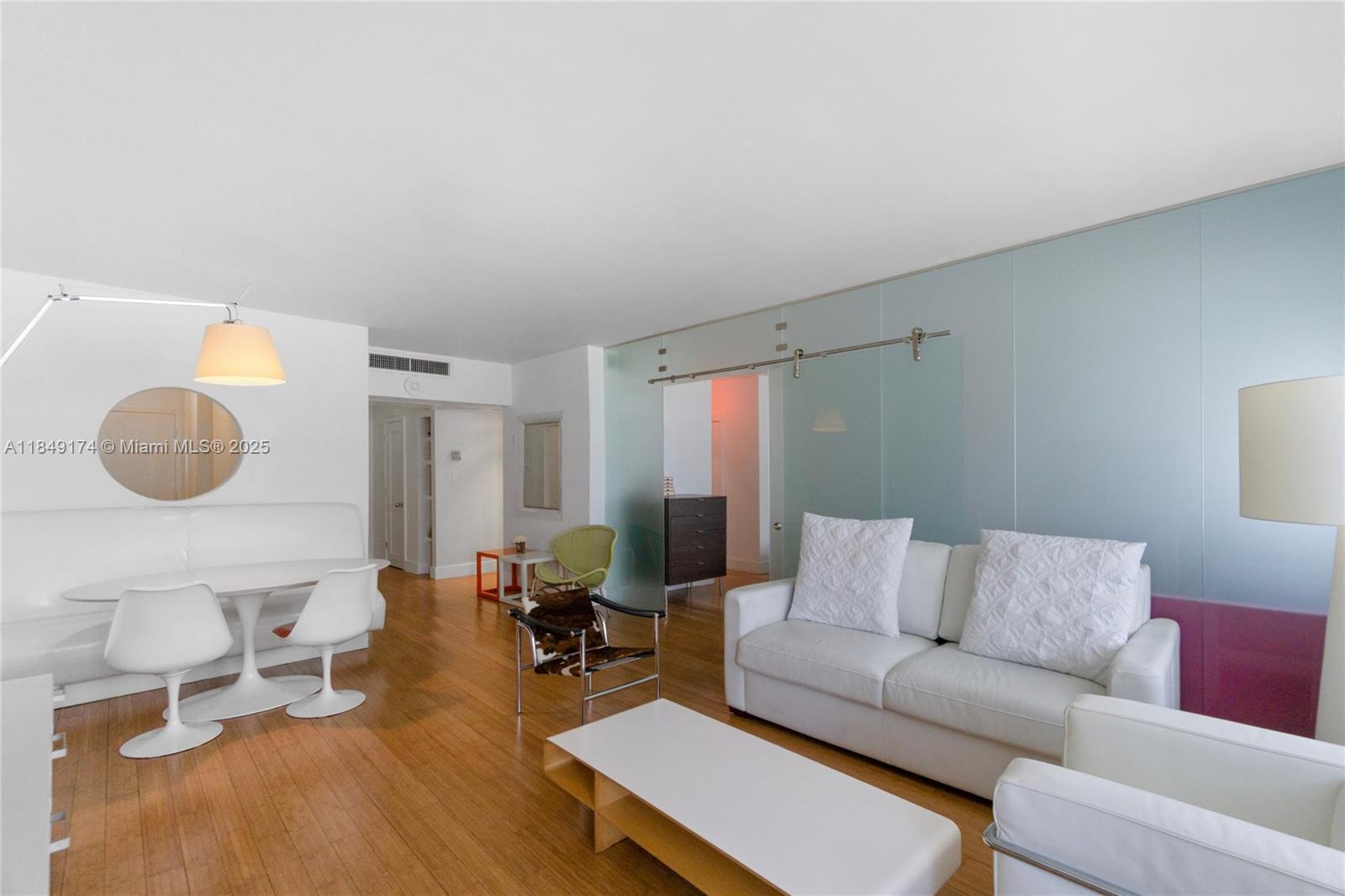 100 Lincoln Road, Unit 923 Miami Beach, FL 33139 - Photo 1 of 31 a living room with furniture and a wooden floor