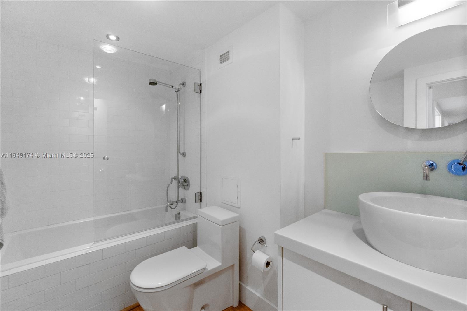 100 Lincoln Road, Unit 923 Miami Beach, FL 33139 - Photo 19 of 31 a bathroom with a sink a toilet and shower