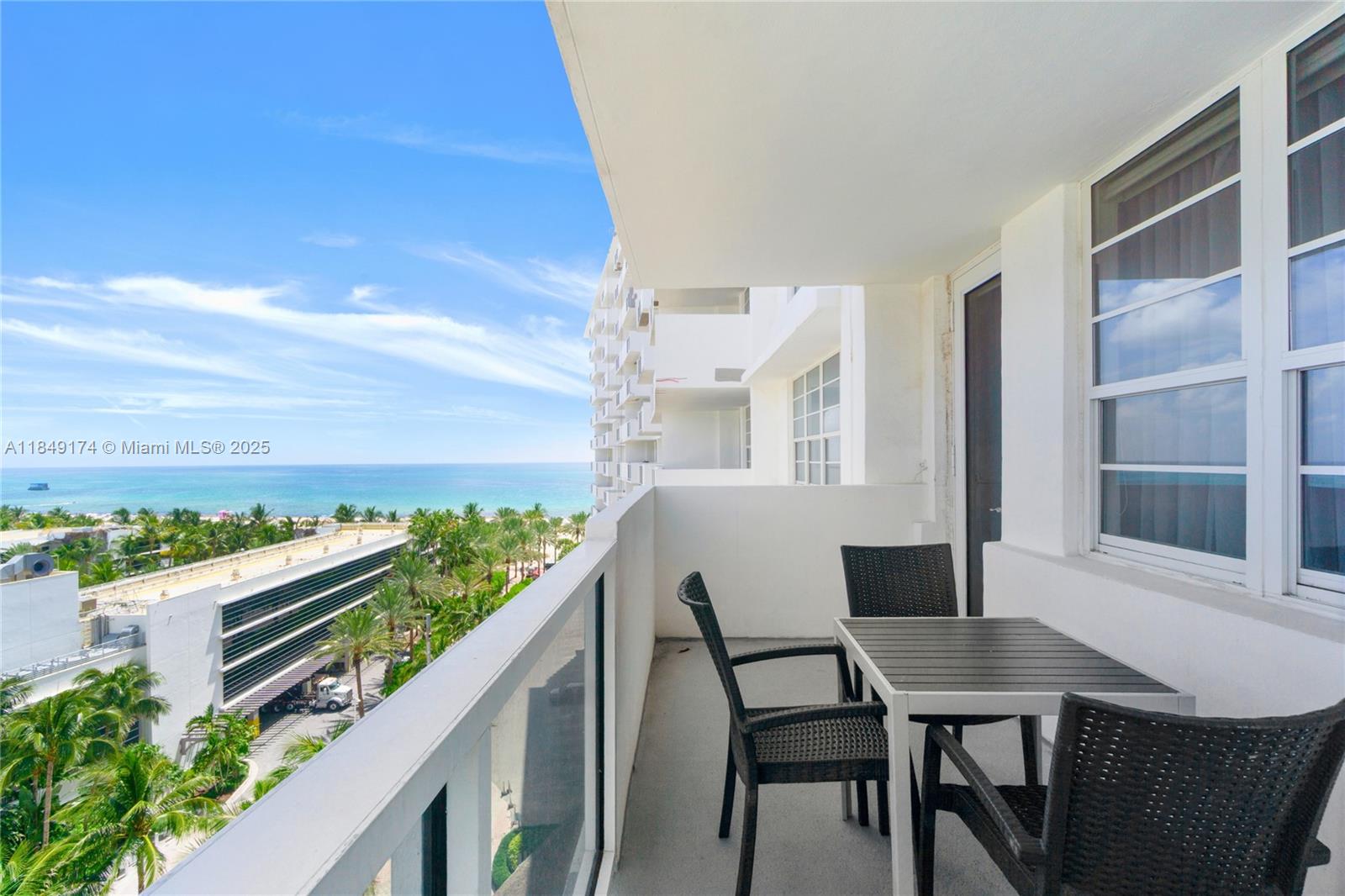 100 Lincoln Road, Unit 923 Miami Beach, FL 33139 - Photo 21 of 31 a balcony with table and chairs