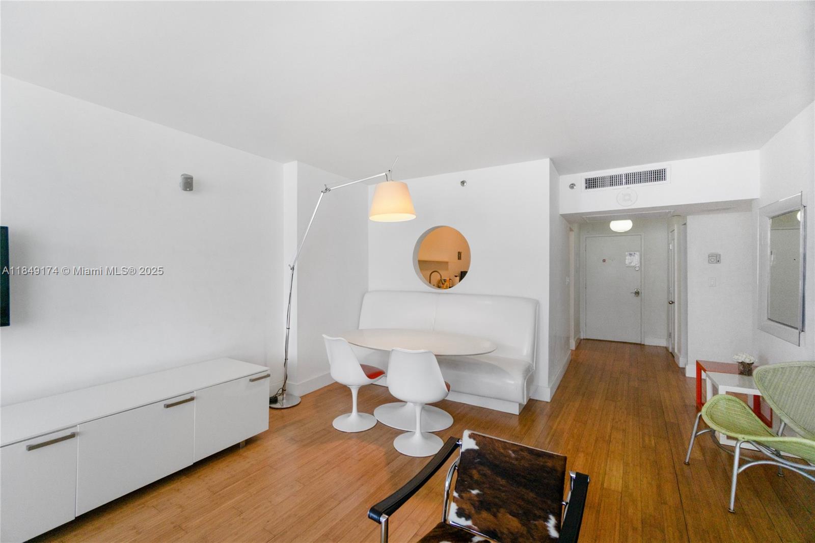 100 Lincoln Road, Unit 923 Miami Beach, FL 33139 - Photo 3 of 31 a living room with a couch and a table