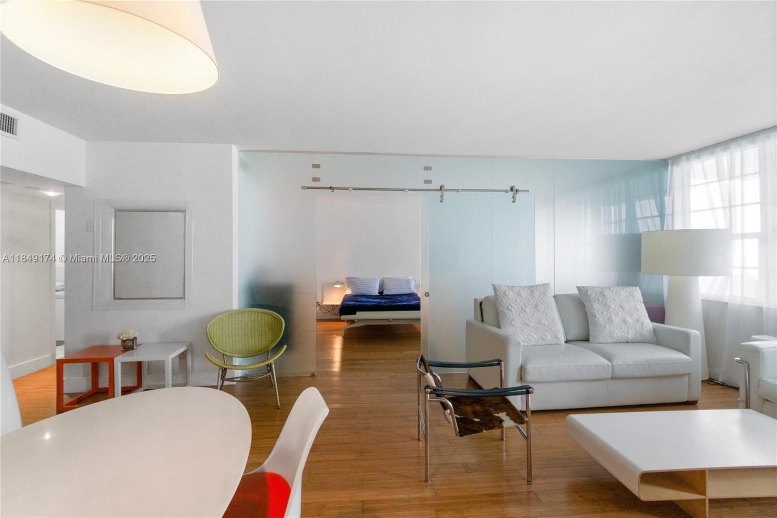 100 Lincoln Road, Unit 923 Miami Beach, FL 33139 - Photo 5 of 31 a living room with furniture and a chair