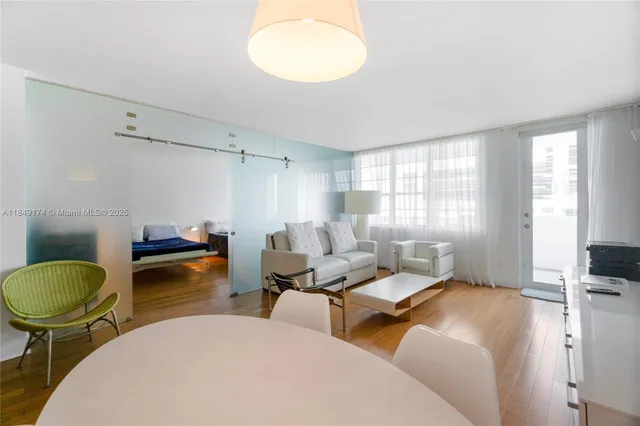 a bedroom with two beds and a chair