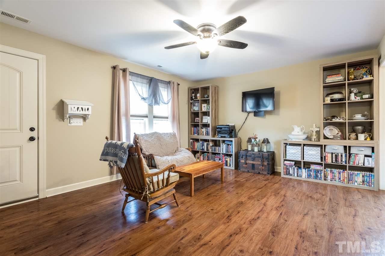 70 Young Road Angier, NC 27501 - Photo 2 of 8 a living room with furniture and a wooden floor