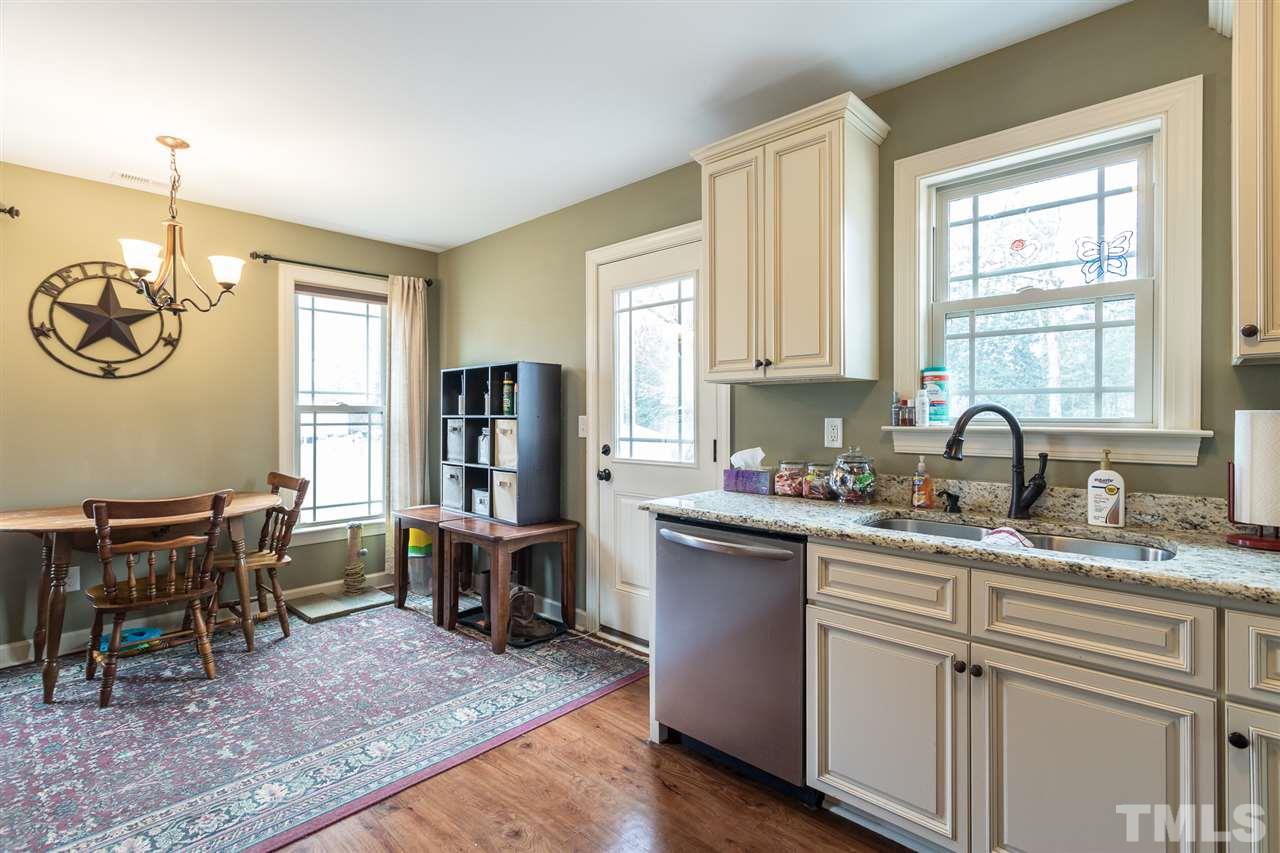 70 Young Road Angier, NC 27501 - Photo 6 of 8 a kitchen with cabinets and window