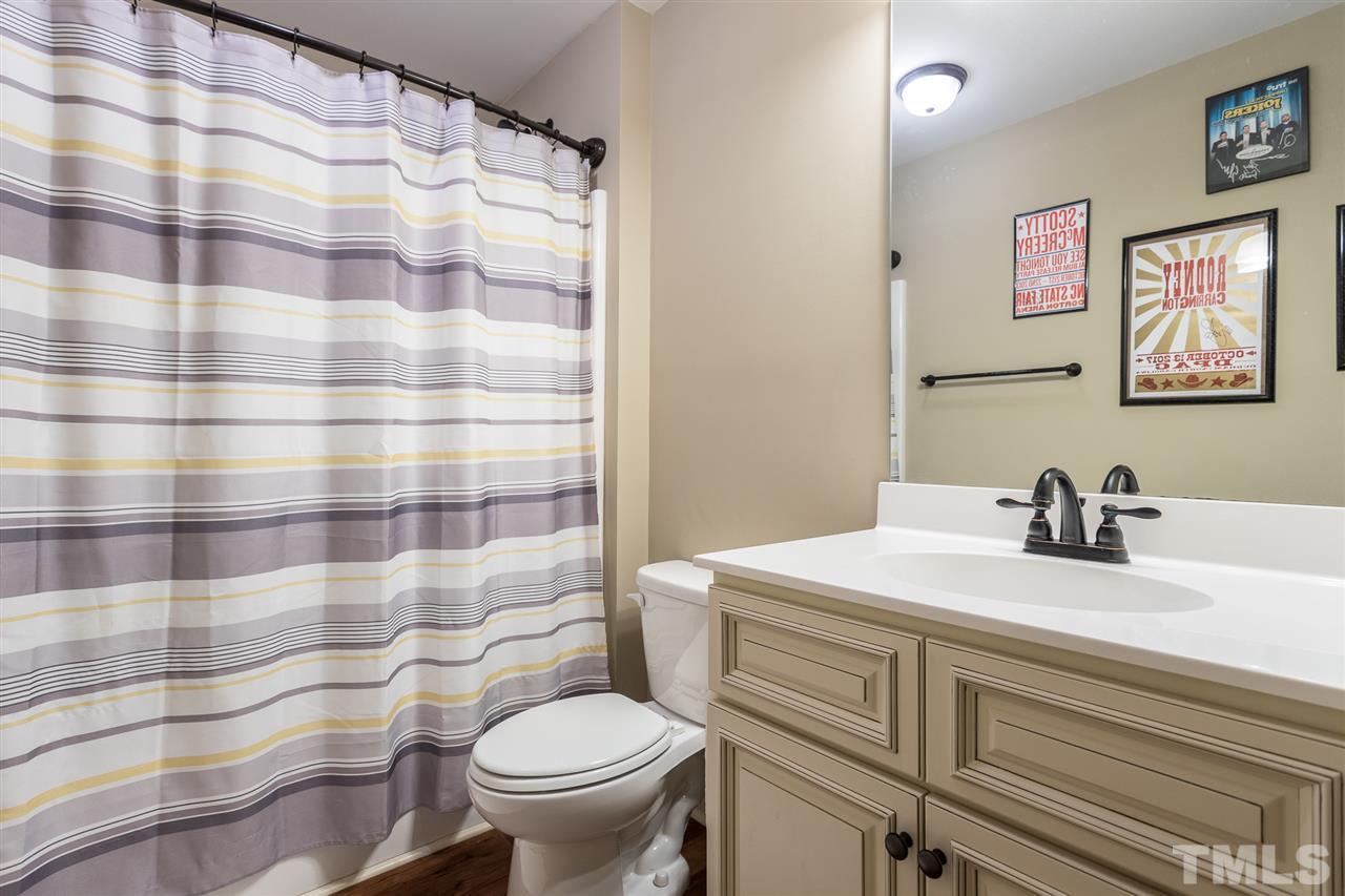 70 Young Road Angier, NC 27501 - Photo 7 of 8 a bathroom with a sink and a toilet