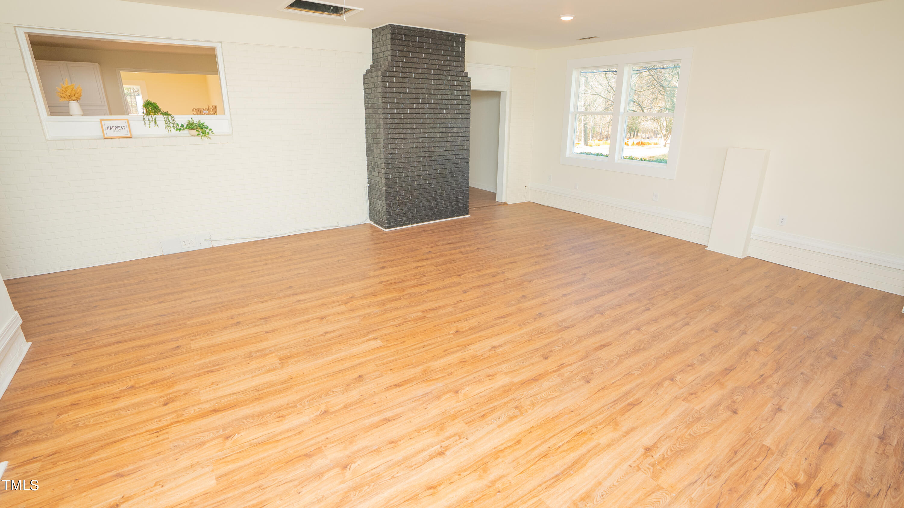2001 Barwell Road Raleigh, NC 27610 - Photo 14 of 79 a view of an empty room with a window