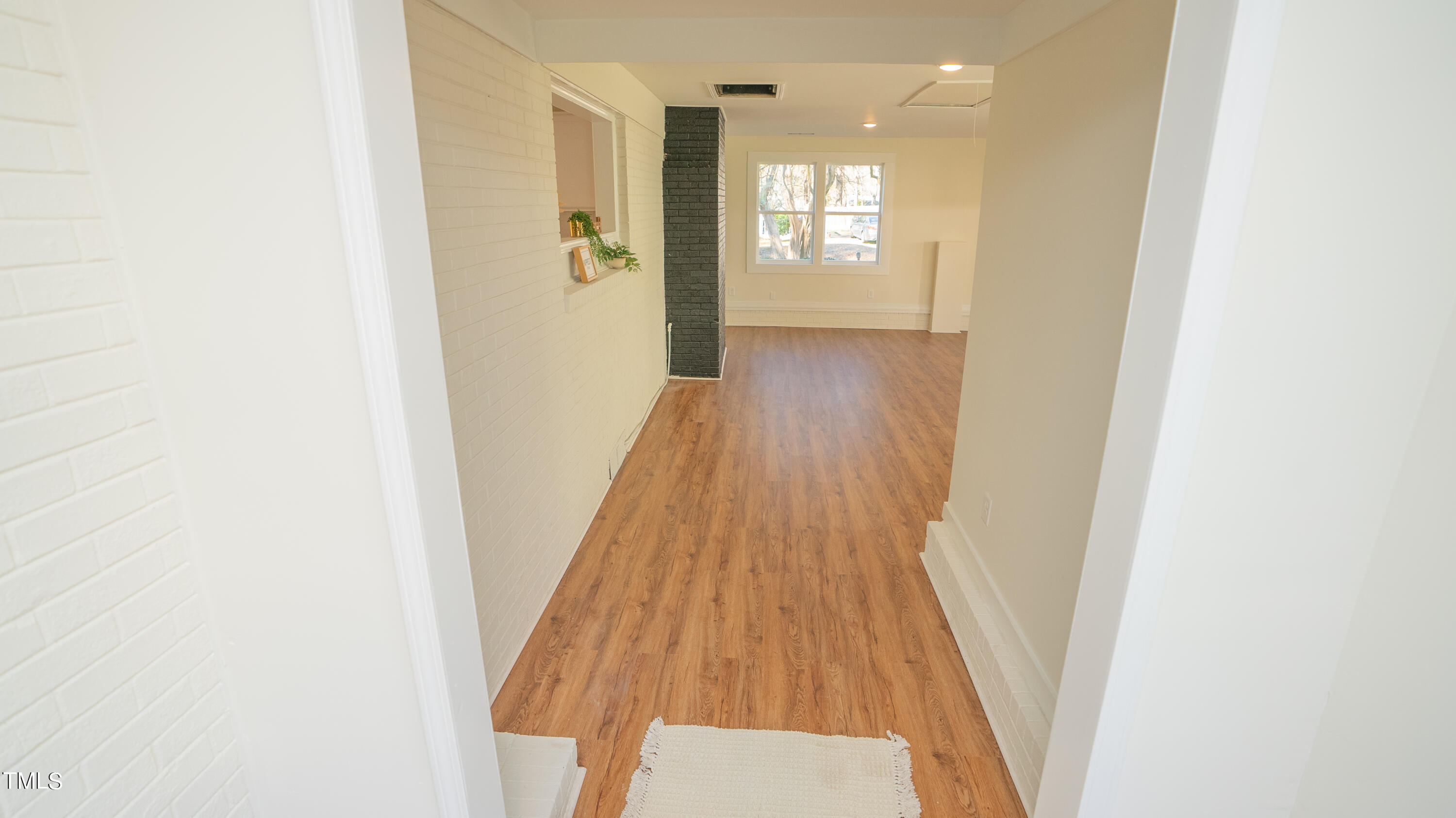 2001 Barwell Road Raleigh, NC 27610 - Photo 17 of 79 a view of a hallway with wooden floor and staircase