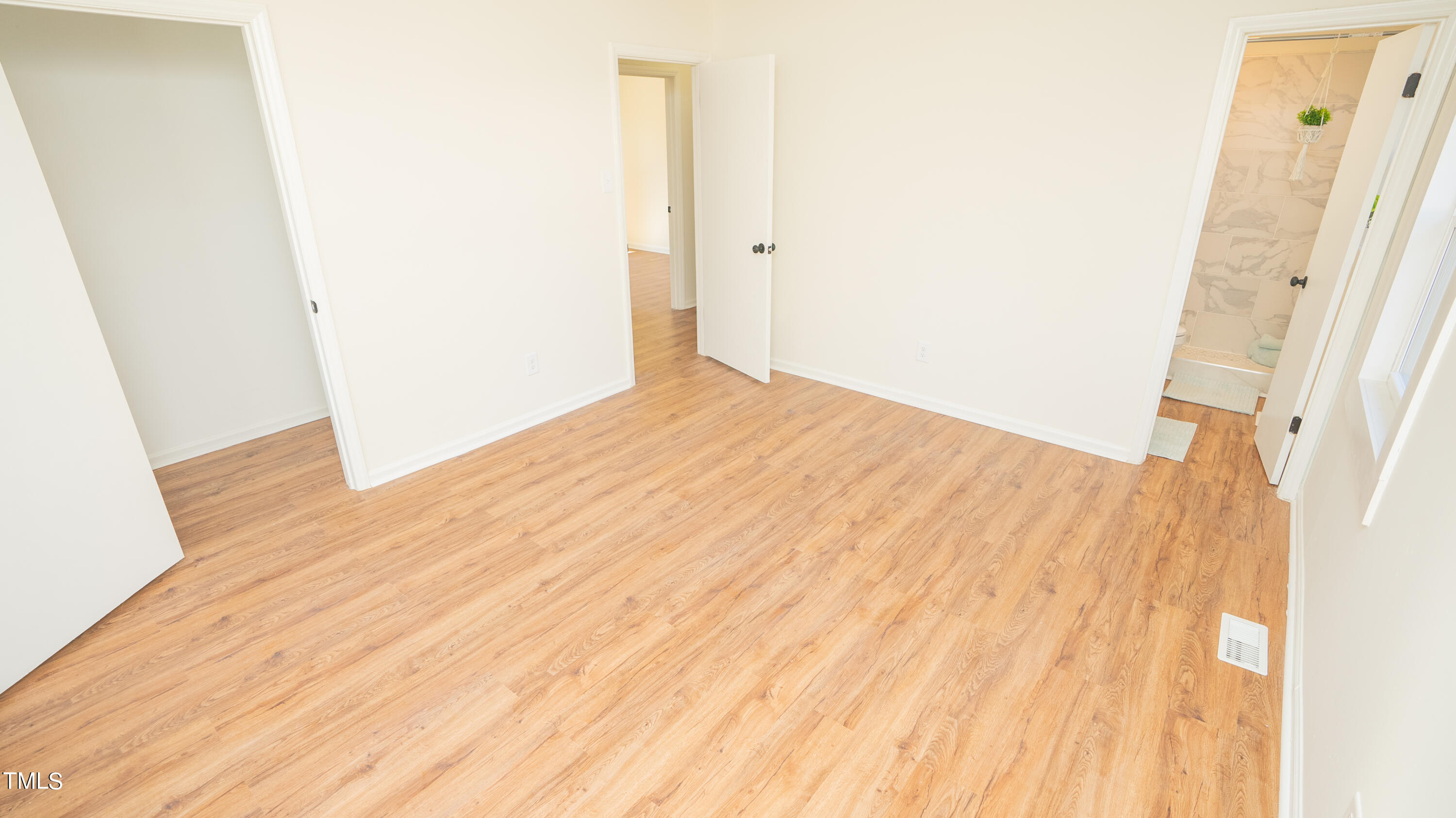 2001 Barwell Road Raleigh, NC 27610 - Photo 24 of 79 a view of empty room with wooden floor