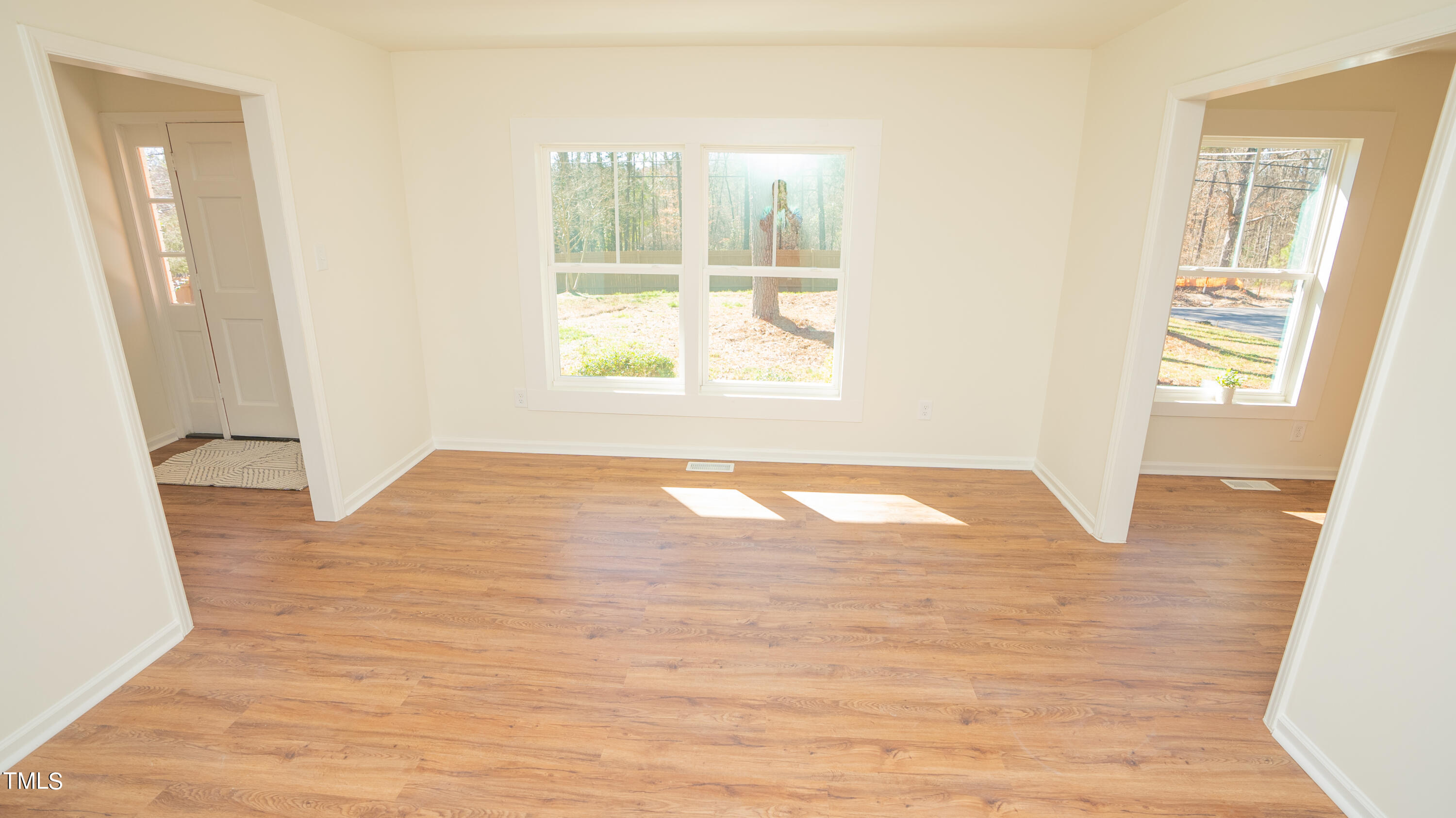 2001 Barwell Road Raleigh, NC 27610 - Photo 36 of 79 a view of empty room with wooden floor and fan
