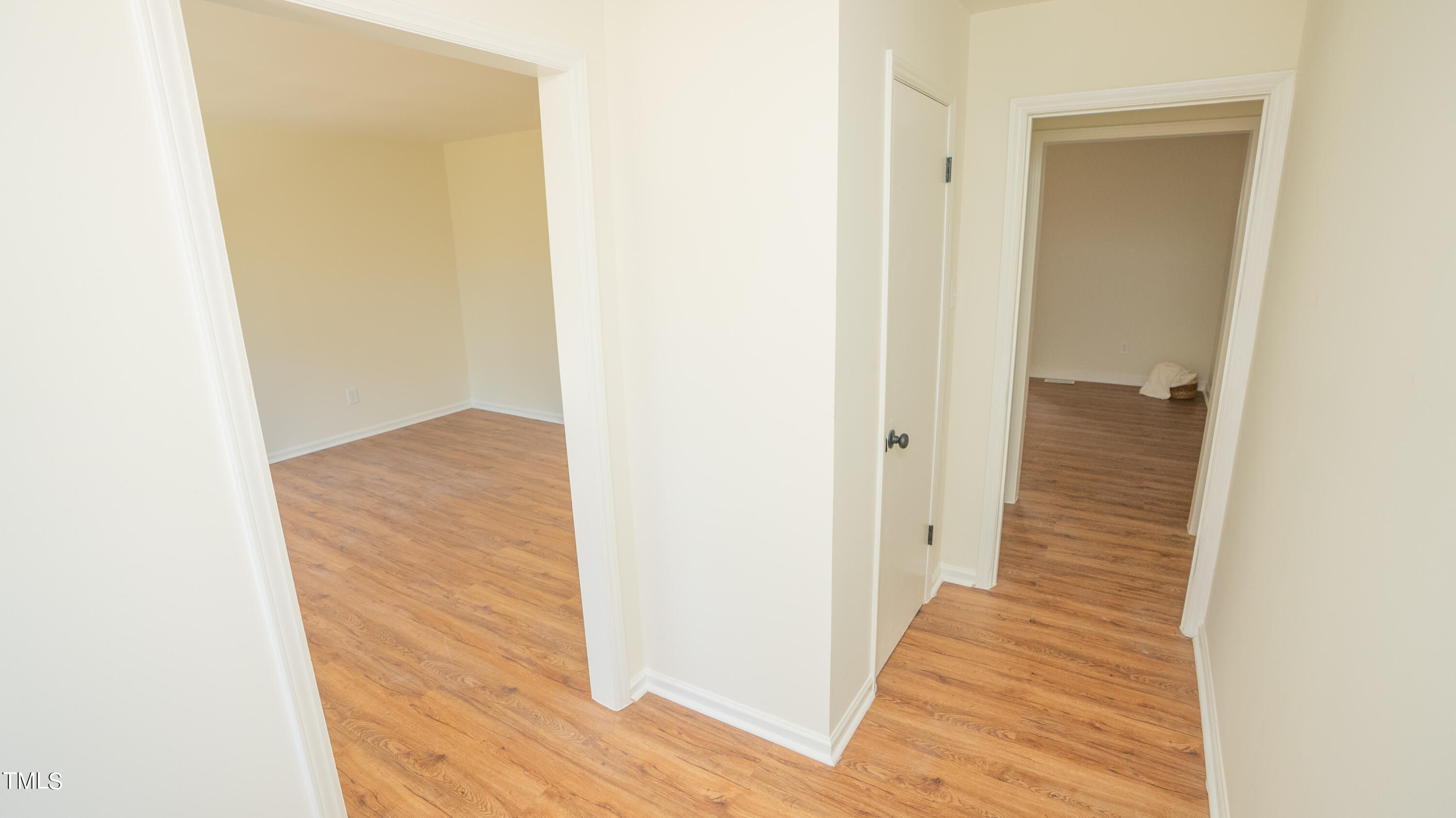 2001 Barwell Road Raleigh, NC 27610 - Photo 37 of 79 a view of a hallway with wooden floor