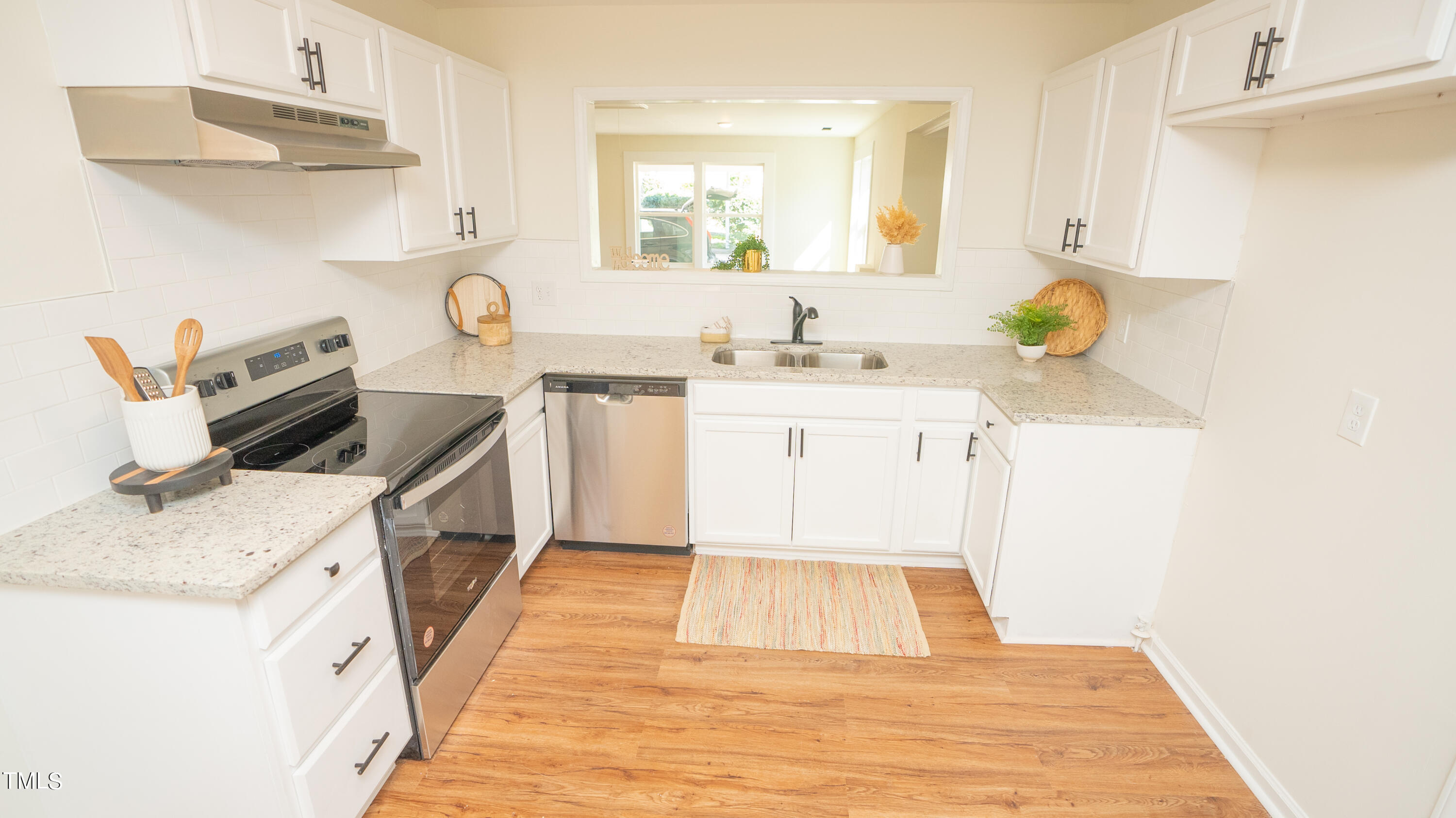 2001 Barwell Road Raleigh, NC 27610 - Photo 6 of 79 a kitchen with a sink appliances and cabinets