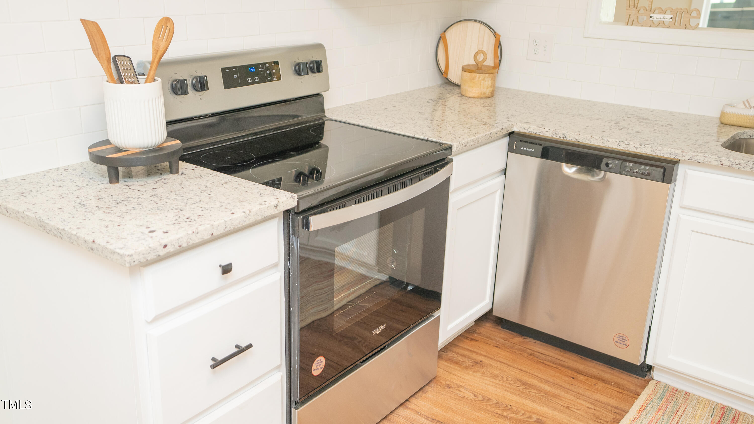 2001 Barwell Road Raleigh, NC 27610 - Photo 7 of 79 a kitchen with a sink a stove and a microwave