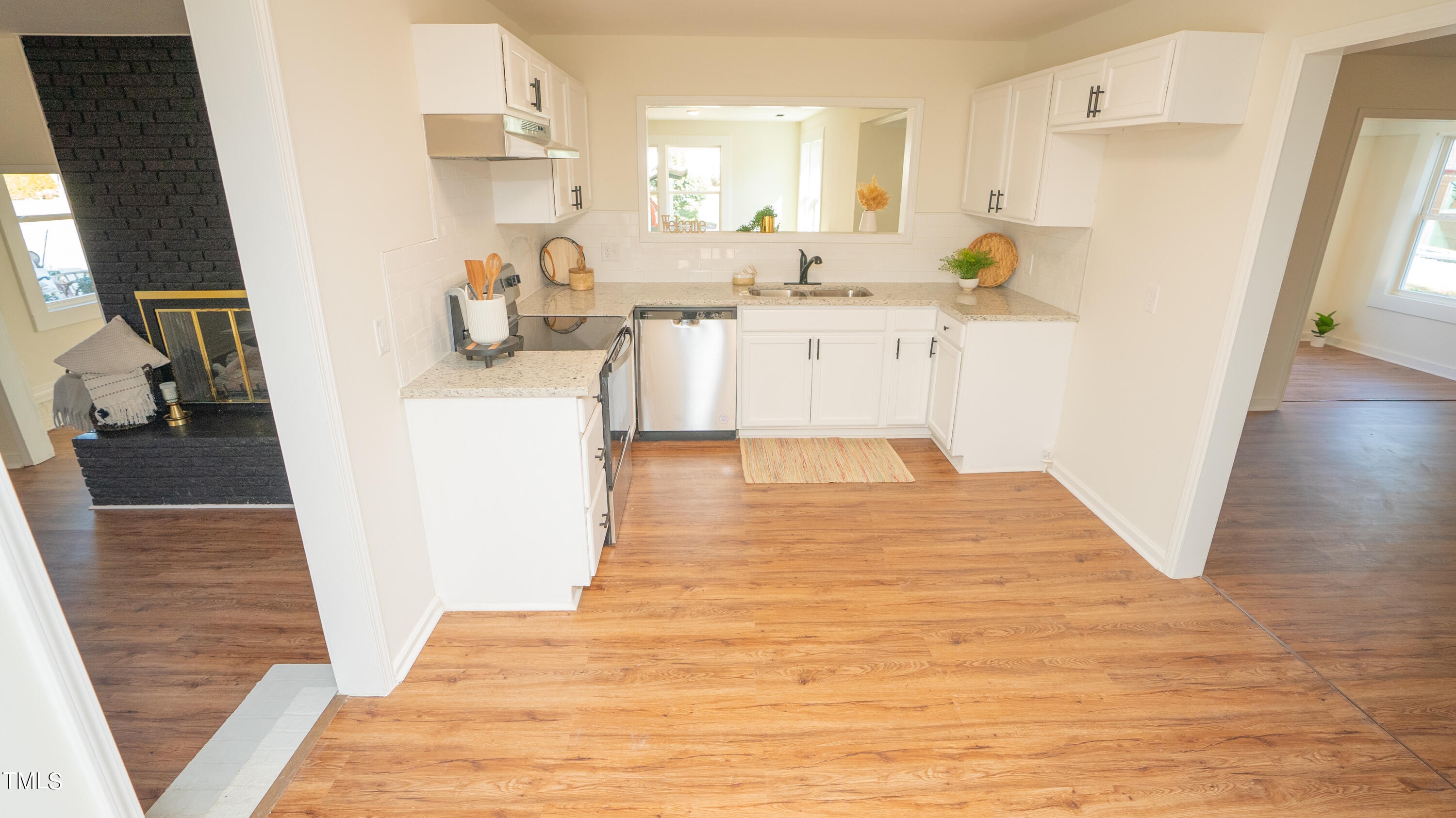 2001 Barwell Road Raleigh, NC 27610 - Photo 8 of 79 a kitchen with a sink a refrigerator and wooden floor