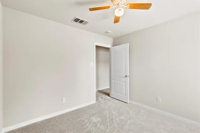 view of an empty room with a window