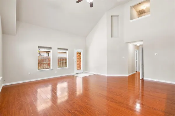 a view of an empty room with glass door