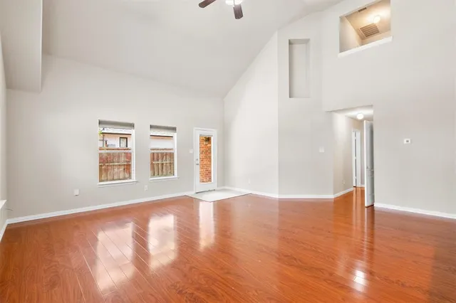 a view of an empty room with glass door