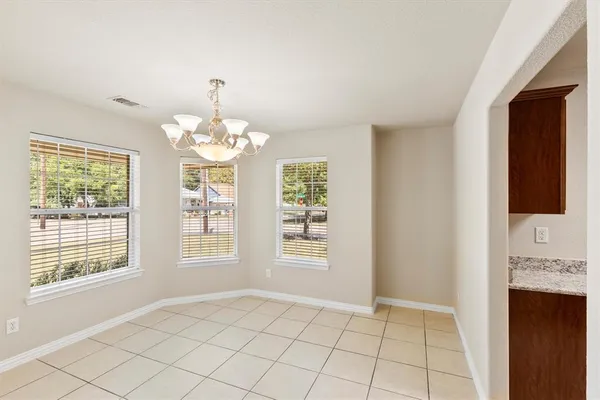 a kitchen with stainless steel appliances granite countertop a sink stove microwave and cabinets