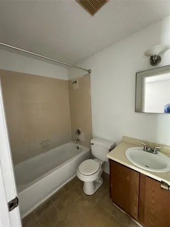 a bathroom with a sink a toilet and a bathtub