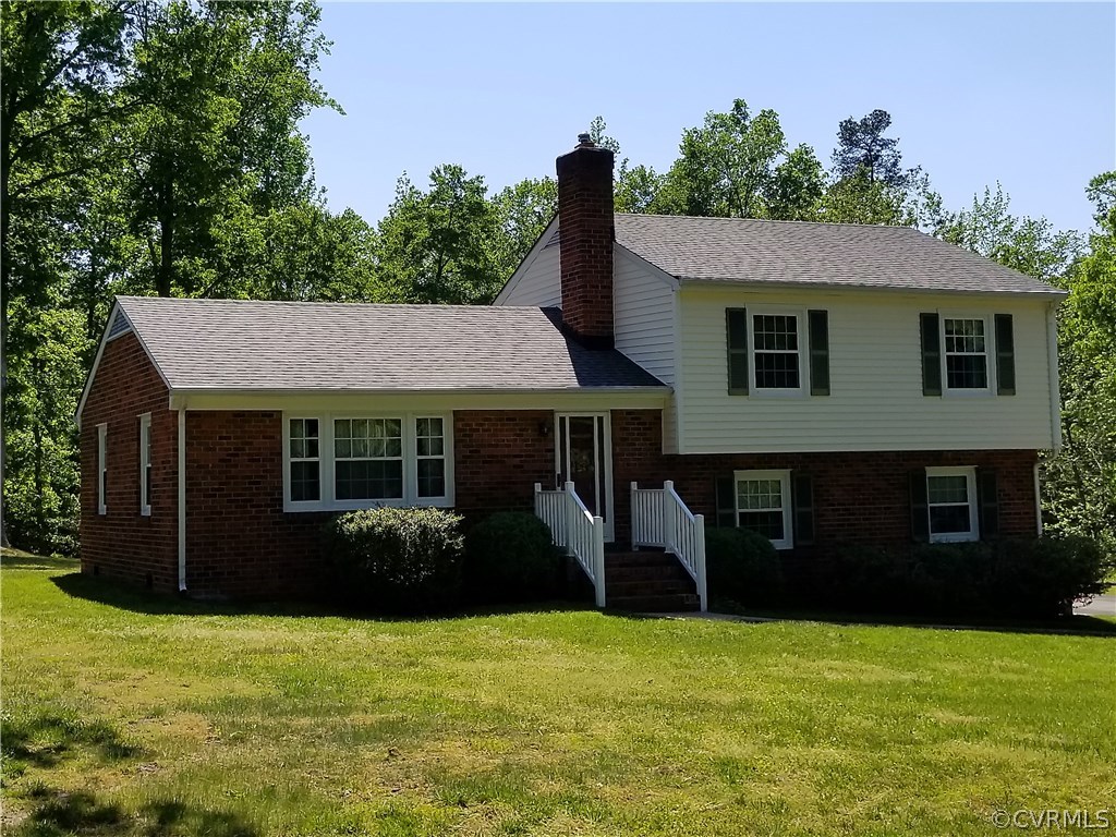 a view of a house with a garden