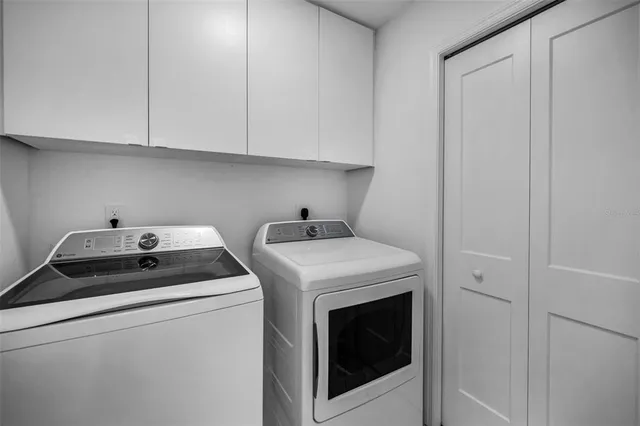 a utility room with dryer and washer