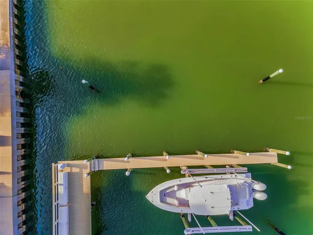 an aerial view of a house with a lake view