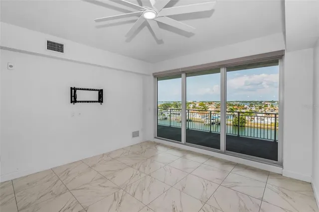 a view of an empty room with windows