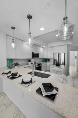 a kitchen with counter top space cabinets and appliances