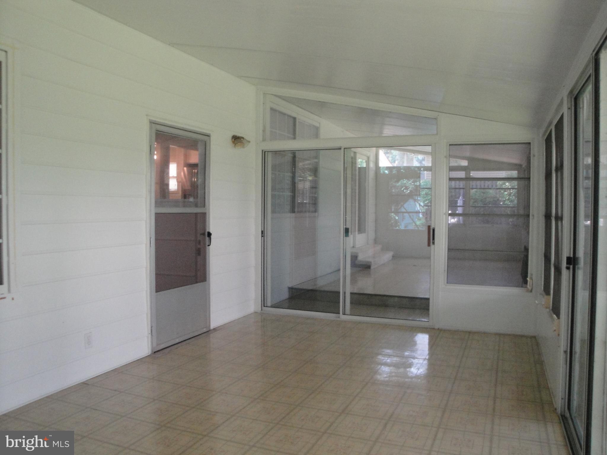 1825 Opalocka Drive McLean, VA 22101 - Photo 21 of 29 Sunroom with Door to Den