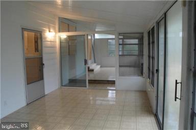1825 Opalocka Drive McLean, VA 22101 - Photo 23 of 29 Sunroom with sliding doors to Fenced Backyard