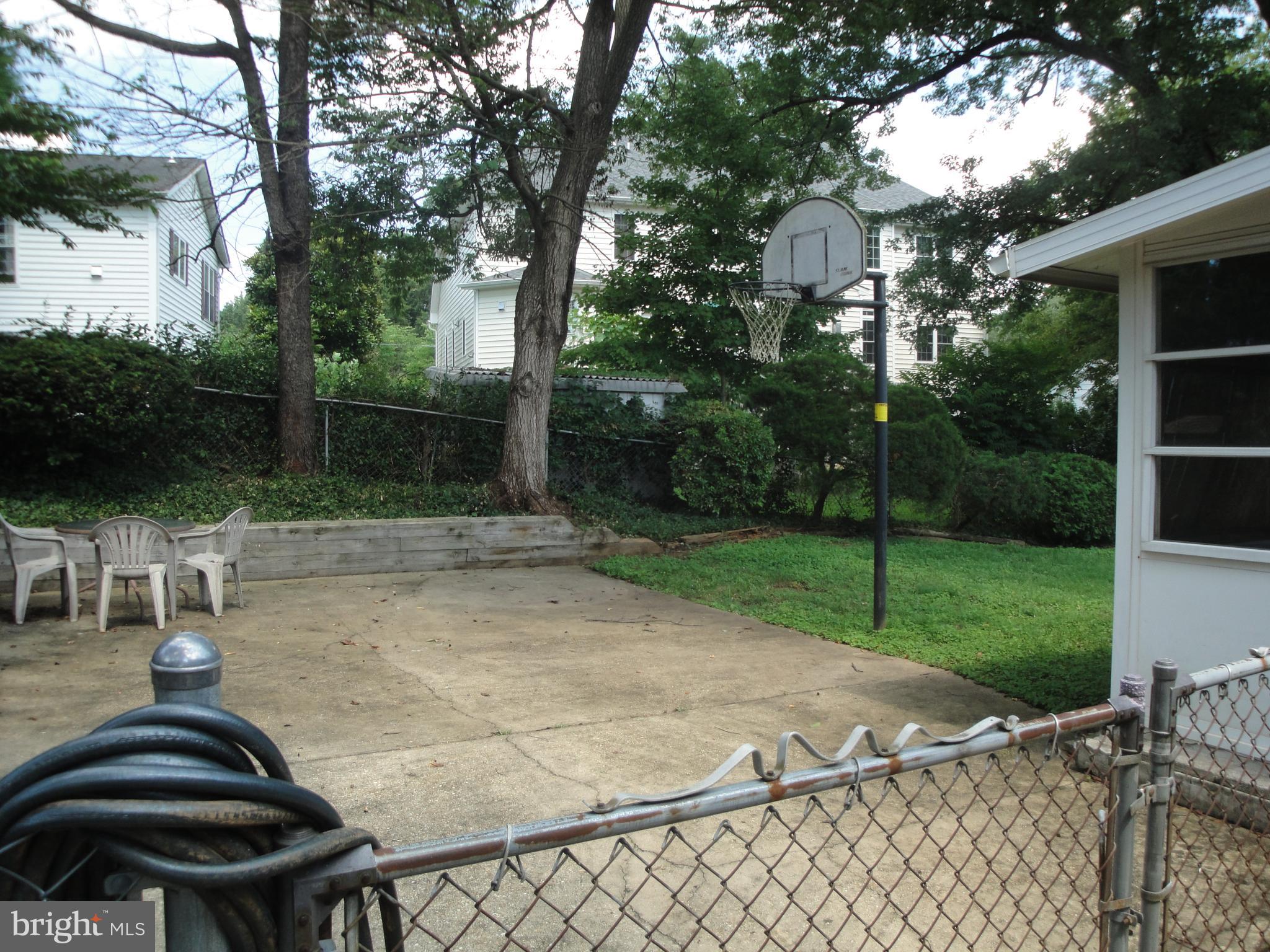 1825 Opalocka Drive McLean, VA 22101 - Photo 28 of 29 Fenced backyard w/ table/chairs & basketball hoop