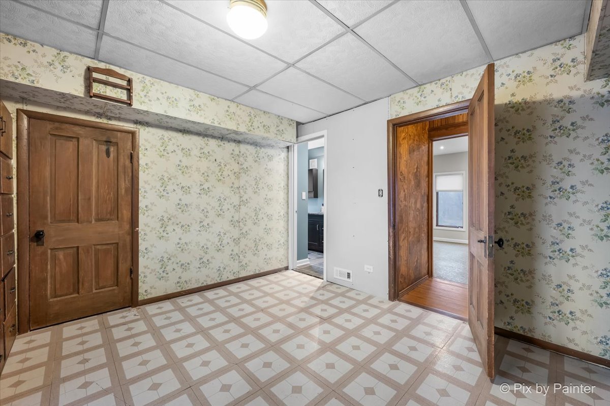 708 South 1st Street DeKalb, IL 60115 - Photo 11 of 17 a bedroom with a bed and a shower