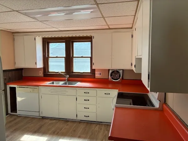 a kitchen with a stove and a sink