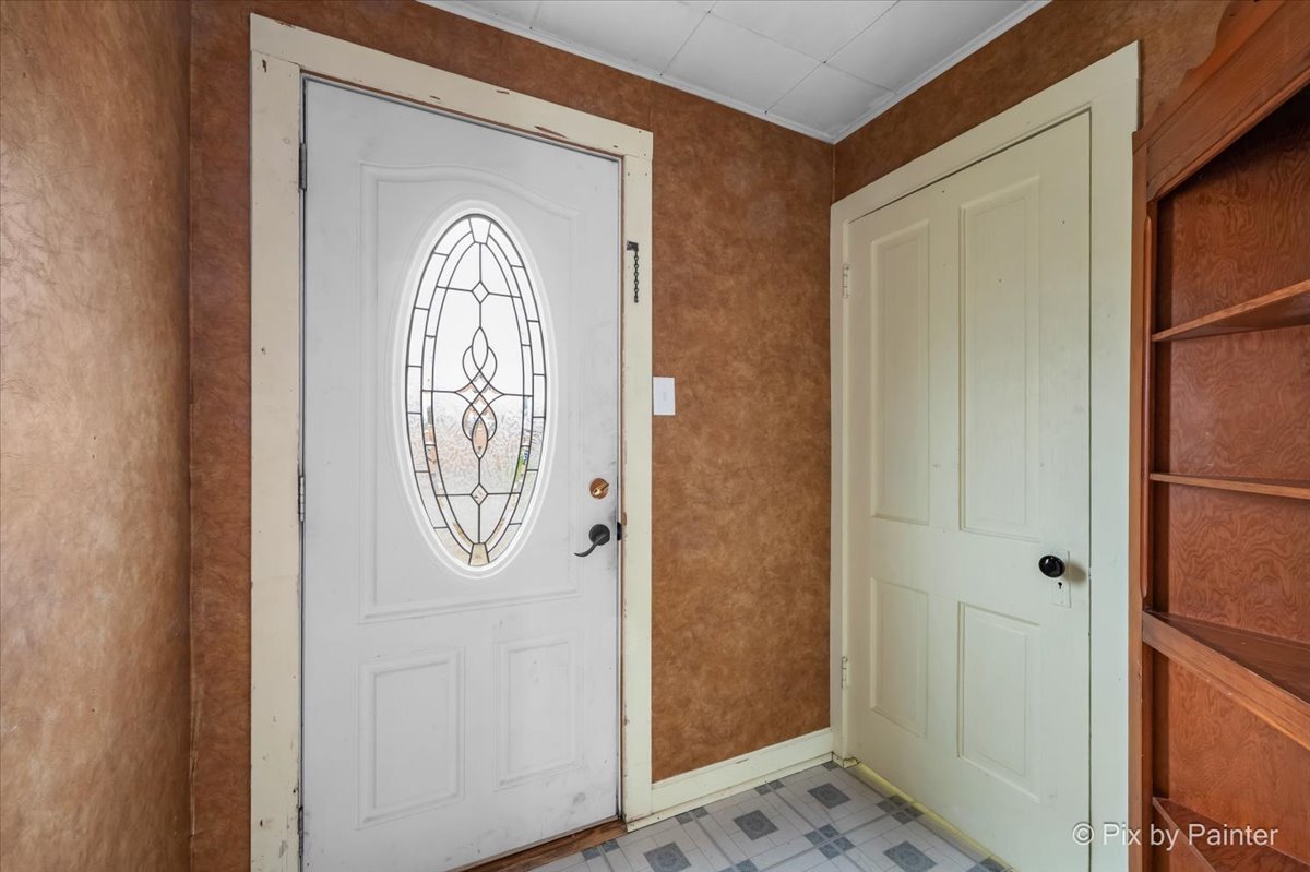 708 South 1st Street DeKalb, IL 60115 - Photo 6 of 17 a view of front door with hallway
