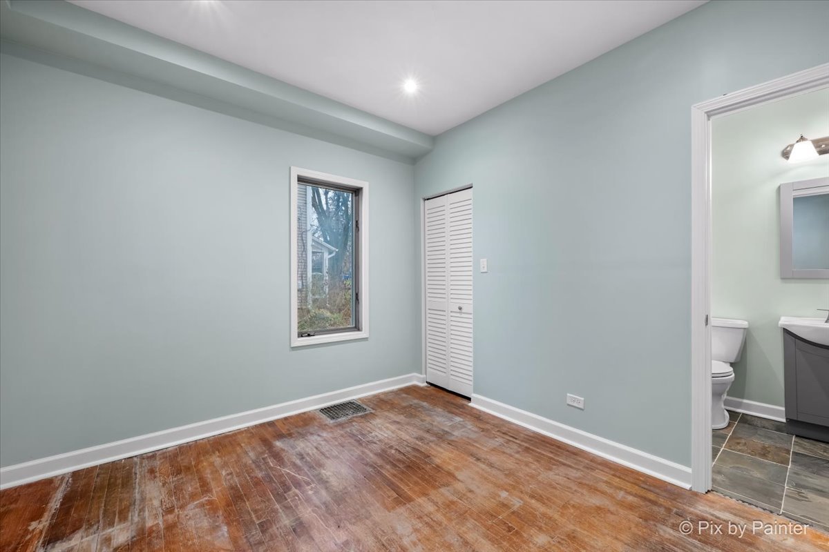 708 South 1st Street DeKalb, IL 60115 - Photo 8 of 17 a view of an empty room and window