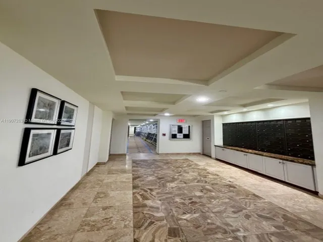 a view of a livingroom with an empty space and a fireplace