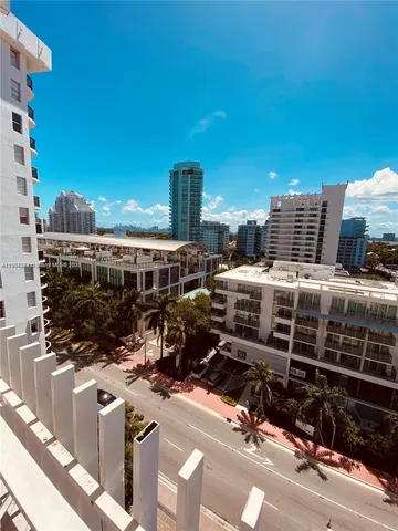 a view of a big yard with an outdoor seating
