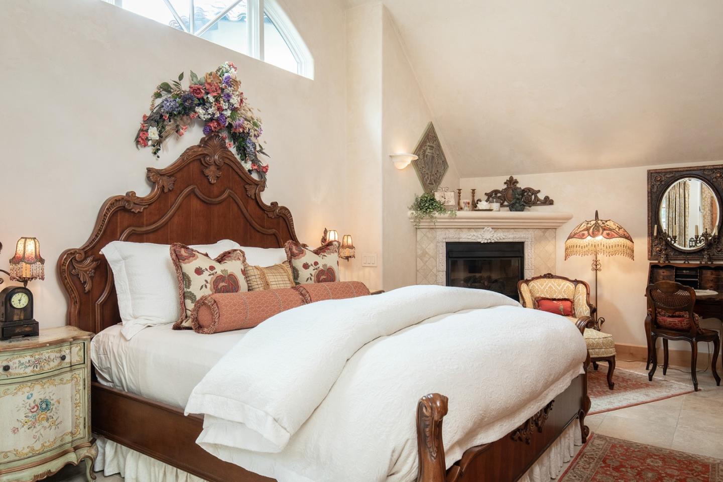 0 Southeast Se Corner Carmel, CA 93923 - Photo 12 of 21 a bedroom with a bed and a chandelier