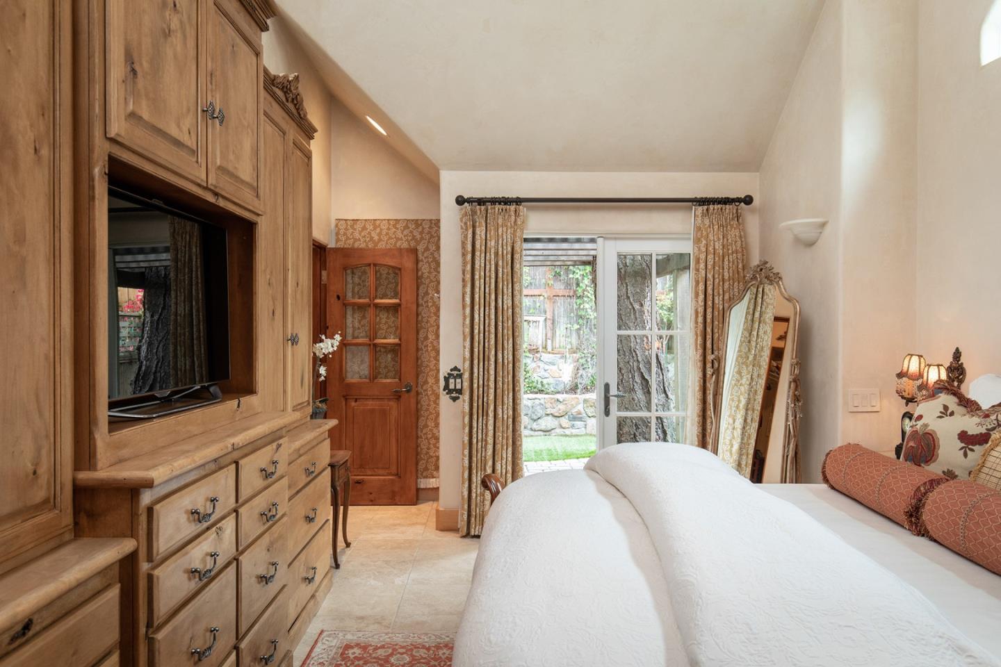 0 Southeast Se Corner Carmel, CA 93923 - Photo 13 of 21 a bedroom with a bed and a flat screen tv