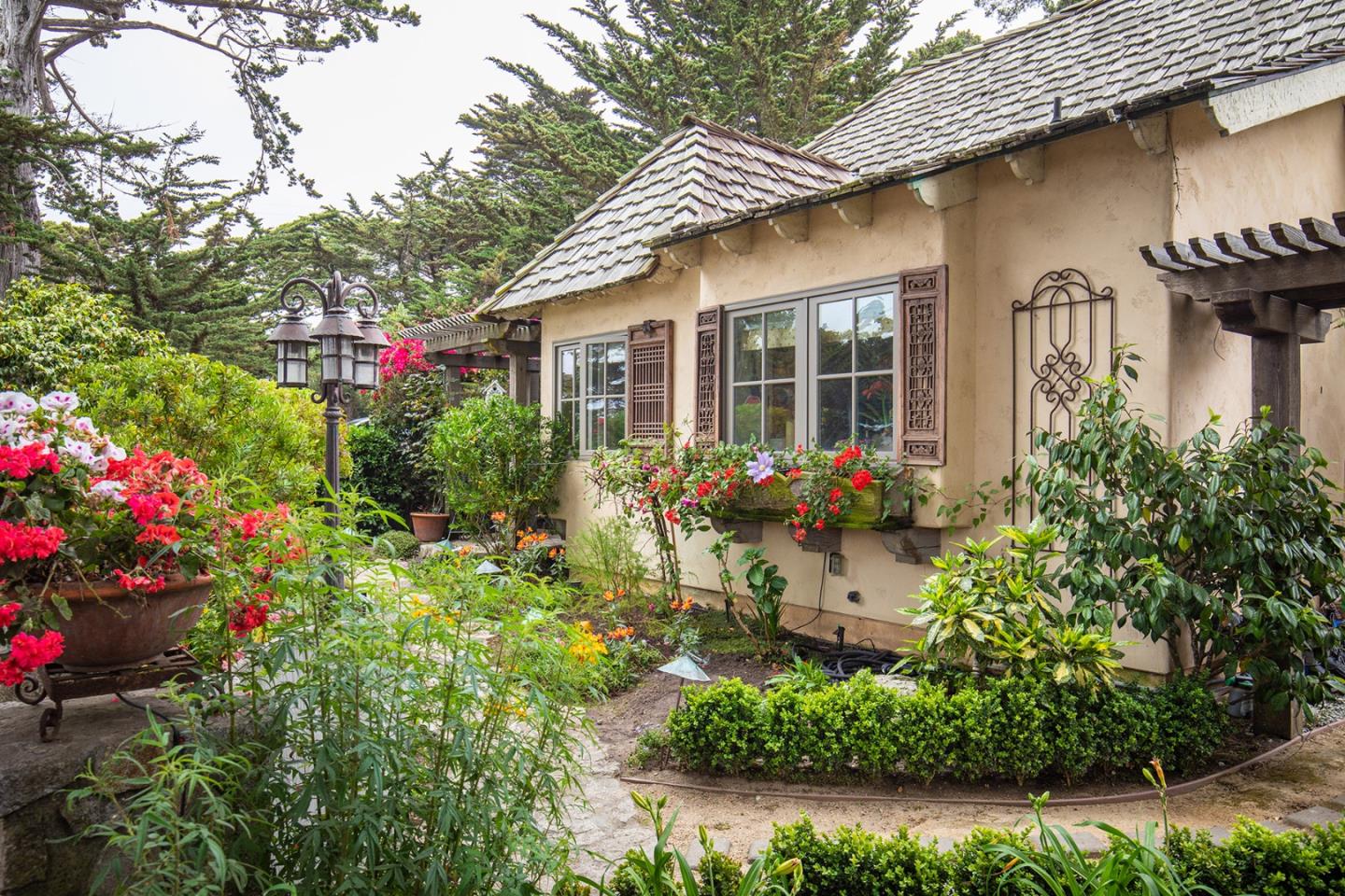 0 Southeast Se Corner Carmel, CA 93923 - Photo 20 of 21 a front view of a house with a yard and fountain