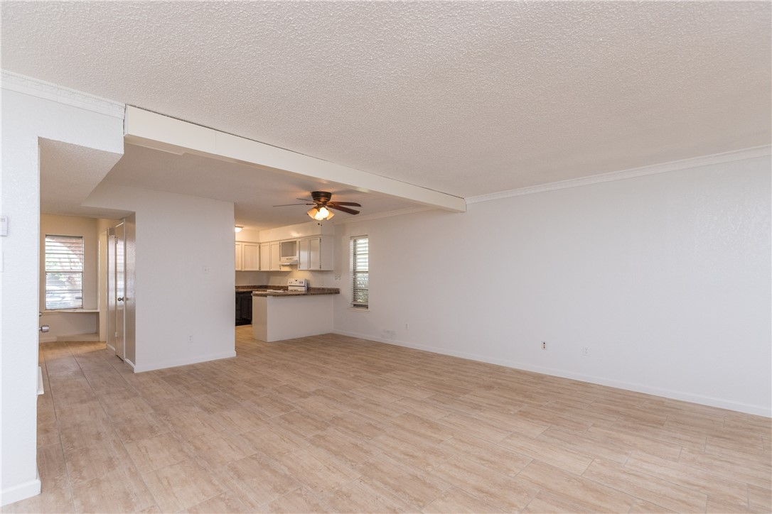 5133 Middlecoff Circle, Unit B Corpus Christi, TX 78413 - Photo 2 of 29 a view of a kitchen with a sink and a refrigerator