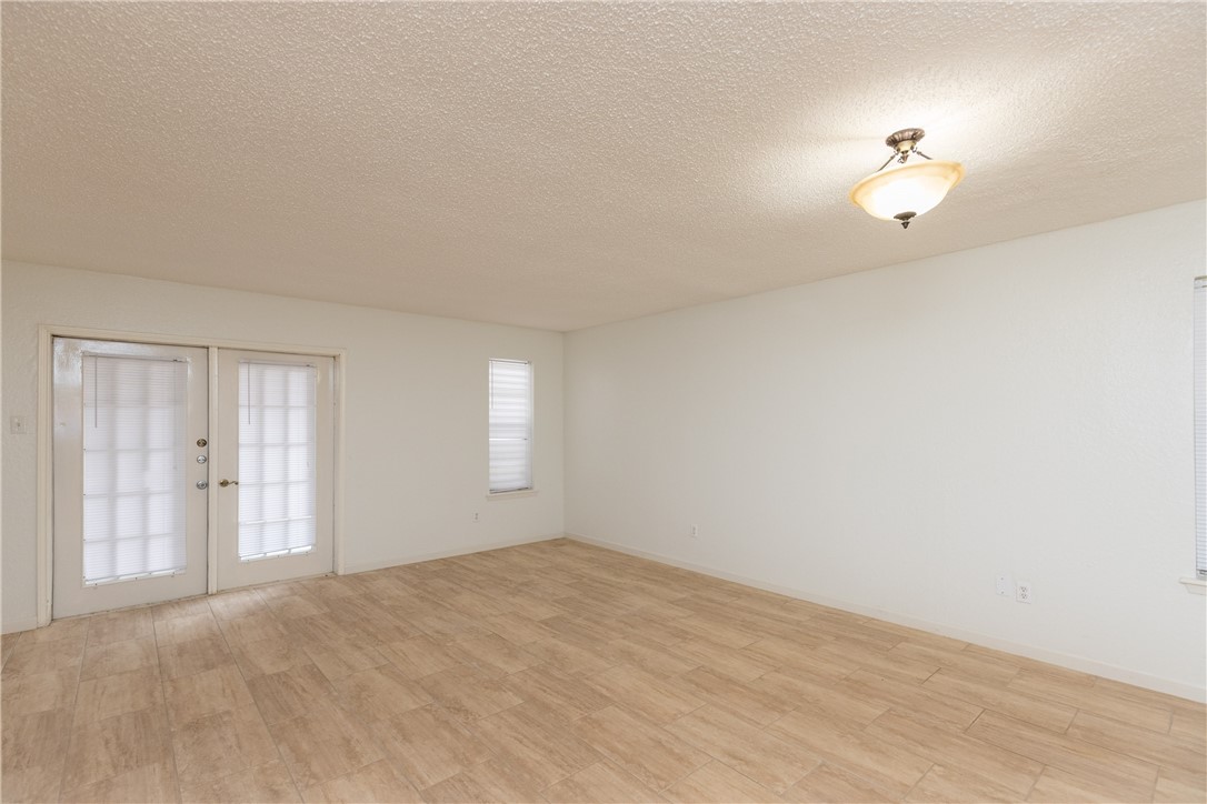 5133 Middlecoff Circle, Unit B Corpus Christi, TX 78413 - Photo 24 of 29 a view of an empty room with a window