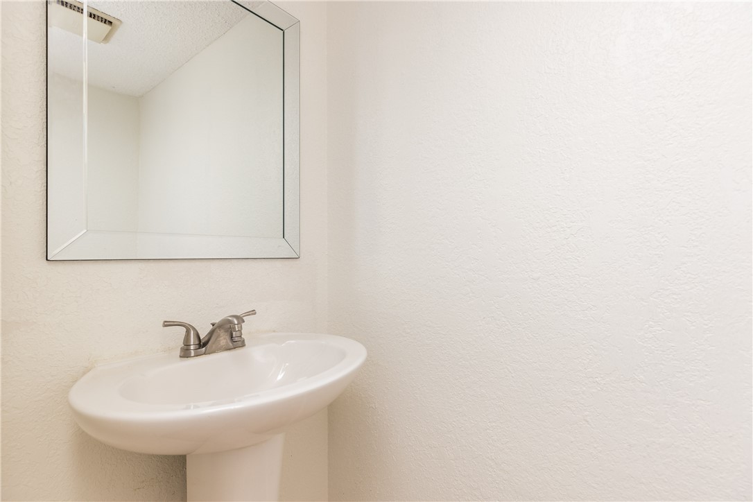5133 Middlecoff Circle, Unit B Corpus Christi, TX 78413 - Photo 25 of 29 a bathroom with a sink and a mirror