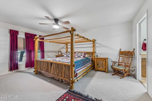 a bed room with furniture and a window
