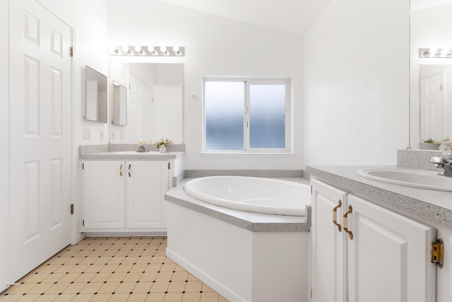 200 Ford Road, Unit 227 San Jose, CA 95138 - Photo 11 of 37 a bathroom with a sink a toilet a mirror and vanity